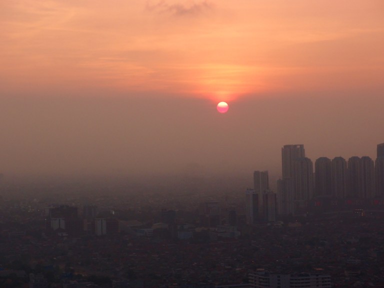 Air pollution in Jakarta, makes the sun appear like it is melting rather than setting.